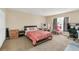 Bedroom with neutral walls, a window, and a desk with a pink chair at 510 Lobelia Dr, Davenport, FL 33837