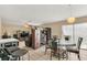 Dining and living area featuring tile flooring, neutral walls, and a versatile layout for entertaining at 510 Lobelia Dr, Davenport, FL 33837