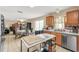 Open kitchen area featuring stainless steel appliances, lots of counter space, and tiled flooring at 510 Lobelia Dr, Davenport, FL 33837