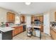 Modern kitchen featuring stainless steel appliances, tile backsplash, and ample cabinet space, perfect for cooking at 510 Lobelia Dr, Davenport, FL 33837