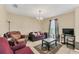 Well-lit living room with modern furnishings, tile flooring, and stylish decor elements creating a cozy ambiance at 510 Lobelia Dr, Davenport, FL 33837