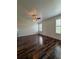 Bedroom featuring wood-look floors, a ceiling fan, and natural light at 5107 Ne 122Nd Blvd, Oxford, FL 34484