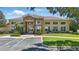 Exterior of community center with large windows and well-maintained landscaping at 5107 Ne 122Nd Blvd, Oxford, FL 34484