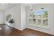Bright dining area featuring plantation shutters and modern lighting fixtures with easy access to the living area at 5107 Ne 122Nd Blvd, Oxford, FL 34484