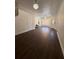 Bright foyer with hardwood flooring, stylish lighting, and a welcoming front entrance at 5107 Ne 122Nd Blvd, Oxford, FL 34484