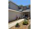 Charming home with a welcoming front entrance, featuring manicured landscaping and stone accents at 5107 Ne 122Nd Blvd, Oxford, FL 34484