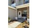 Close-up of the front porch and door, with plants and a walkway leading to the entrance at 5107 Ne 122Nd Blvd, Oxford, FL 34484