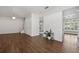 Bright and spacious living room featuring hardwood floors and modern lighting. Lots of room for entertaining at 5107 Ne 122Nd Blvd, Oxford, FL 34484