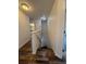 View of the stairway featuring hardwood steps and white walls leading to the upper level at 5107 Ne 122Nd Blvd, Oxford, FL 34484