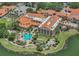 Aerial view of the community recreation center, pool, and manicured grounds at 532 Casanova Ct, Kissimmee, FL 34759