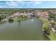Aerial view of community featuring a waterfront recreation center with resort-style amenities at 532 Casanova Ct, Kissimmee, FL 34759