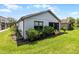 Image of a backyard featuring a well-manicured lawn, privacy landscaping, and the home's exterior at 532 Casanova Ct, Kissimmee, FL 34759