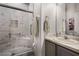 Bathroom featuring marble tile shower with seat and modern fixtures at 532 Casanova Ct, Kissimmee, FL 34759