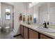 Bathroom with large mirror, towel racks, and modern fixtures and shower at 532 Casanova Ct, Kissimmee, FL 34759
