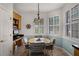 Charming dining area with a round table, comfortable chairs, and a built-in desk for added convenience at 532 Casanova Ct, Kissimmee, FL 34759