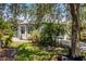 Charming home exterior featuring mature landscaping, a paver walkway, and decorative shutters at 532 Casanova Ct, Kissimmee, FL 34759