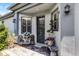Inviting front porch with decorative seating, plants, and stylish exterior lighting at 532 Casanova Ct, Kissimmee, FL 34759