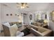 Bright living room featuring comfortable seating, a ceiling fan, and natural light at 532 Casanova Ct, Kissimmee, FL 34759