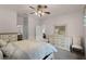 Bright main bedroom with a ceiling fan, ensuite access, and furniture at 532 Casanova Ct, Kissimmee, FL 34759