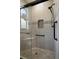Beautiful shower featuring a rain shower head, bench seat, and convenient grab bars at 532 Casanova Ct, Kissimmee, FL 34759