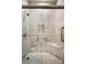 New shower with marble tile, shower head, built in seat and shower door at 532 Casanova Ct, Kissimmee, FL 34759