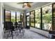 Enclosed sunroom with large windows, brick flooring, and an outdoor view at 532 Casanova Ct, Kissimmee, FL 34759
