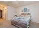 Relaxing bedroom with rustic wooden bed frame, neutral tones, and soft carpet at 5367 Douglas Fir Dr, St Cloud, FL 34771