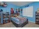 Bright bedroom featuring a large window and carpeted floor at 5367 Douglas Fir Dr, St Cloud, FL 34771