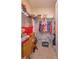 Walk-in closet featuring built-in shelving and ample storage space at 5367 Douglas Fir Dr, St Cloud, FL 34771