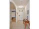 Hallway with tile floors, arched doorway and foyer table at 5367 Douglas Fir Dr, St Cloud, FL 34771