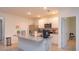 Contemporary kitchen featuring granite countertops, stainless steel appliances, and tile flooring at 5367 Douglas Fir Dr, St Cloud, FL 34771