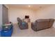 Spacious living room with comfortable seating, tile flooring, and neutral color scheme at 5367 Douglas Fir Dr, St Cloud, FL 34771