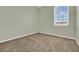 Empty bedroom with a large window overlooking the neighborhood at 540 Monroe Cir, Davenport, FL 33896