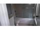 Bathroom with tile floor and a tub/shower with sliding glass door at 5418 Brookswood Way # 100 Brookwood Way # 1008, Orlando, FL 32808