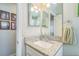 Cozy bathroom featuring granite countertop, white vanity, and a well-lit mirror for a clean and modern look at 544 Remington Oak Dr, Lake Mary, FL 32746