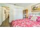 Inviting bedroom with a comfortable bed, closet, and bookshelf, perfect for relaxing and unwinding at 544 Remington Oak Dr, Lake Mary, FL 32746