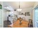 Dining area with stainless steel appliances and granite counters is adjacent to the kitchen at 544 Remington Oak Dr, Lake Mary, FL 32746
