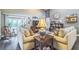 Open floorplan living room with hardwood floors, neutral paint, and backyard access at 544 Remington Oak Dr, Lake Mary, FL 32746