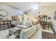 Open floorplan living room featuring neutral paint, cathedral ceilings, and hardwood floors at 544 Remington Oak Dr, Lake Mary, FL 32746