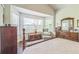 Spacious main bedroom with lots of natural light, a bay window and wooden furniture at 544 Remington Oak Dr, Lake Mary, FL 32746