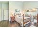 Main bedroom with hardwood floors and a sliding door to the screened patio at 544 Remington Oak Dr, Lake Mary, FL 32746