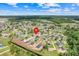 A picturesque aerial view of the neighborhood showcases mature trees and single-Gathering homes at 560 Viceroy Ct, Kissimmee, FL 34758