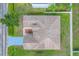 Aerial view of a well-maintained house with a long driveway and landscaped front yard at 560 Viceroy Ct, Kissimmee, FL 34758