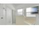 Bathroom with a separate glass shower and soaking tub next to the privacy window at 560 Viceroy Ct, Kissimmee, FL 34758