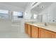 Bathroom featuring double sinks, a soaking tub, and a separate shower at 560 Viceroy Ct, Kissimmee, FL 34758