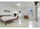 Spacious bedroom with tile floors, natural light, and neutral colors at 560 Viceroy Ct, Kissimmee, FL 34758