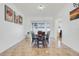 Open dining room features natural light with contemporary lighting fixture and wall decor at 560 Viceroy Ct, Kissimmee, FL 34758