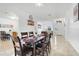 Bright dining room area with modern tile flooring, and views to the front entry and kitchen at 560 Viceroy Ct, Kissimmee, FL 34758