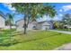 Charming single-story home featuring a well-maintained lawn and a two-car garage at 560 Viceroy Ct, Kissimmee, FL 34758