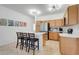 Kitchen featuring stainless appliances, a breakfast bar, and ample storage space at 560 Viceroy Ct, Kissimmee, FL 34758